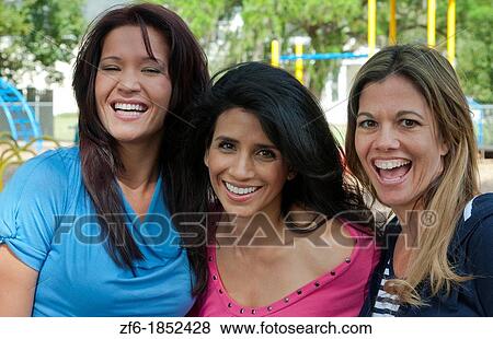 Girlfriends having fun in park aged 30s laughing and excitement in outdoors playground buddies View Large Photo Image Stock Photo - Girlfriends having fun in park aged 30s laughing and excitement in outdoors playground buddies. Fotosearch