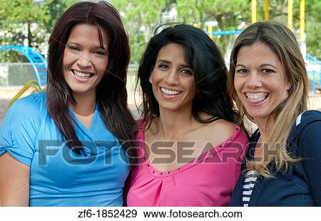 Girlfriends having fun in park aged 30s laughing and excitement in outdoors playground buddies View Large Photo Image Stock Photo - Girlfriends having fun in park aged 30s laughing and excitement in outdoors playground buddies. Fotosearch