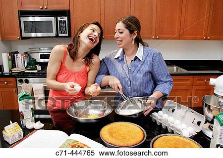 Girlfriends making cake View Large Photo Image Stock Photography - Girlfriends making cake. Fotosearch