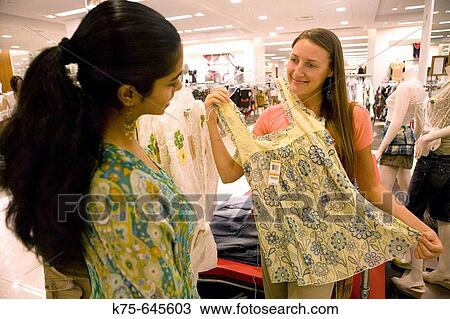Stock Image - Girlfriends shopping. Fotosearch