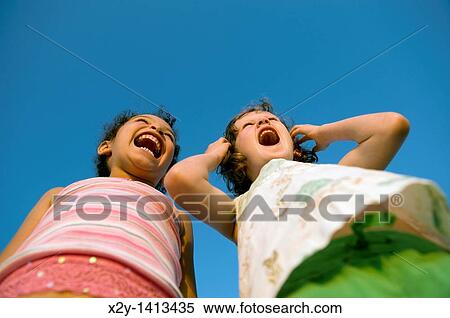 Girlfriends yelling in delight View Large Photo Image Stock Photography - Girlfriends yelling in delight. Fotosearch