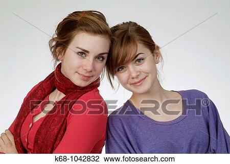Girls, 14 and 18 in studio View Large Photo Image Stock Image - Girls, 14 and 18 in studio. Fotosearch