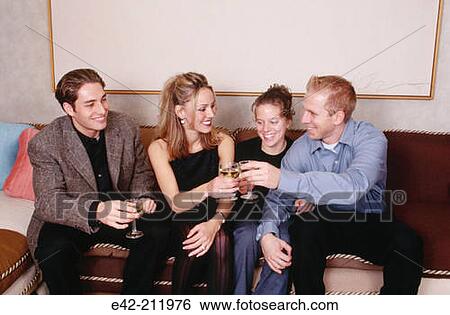 Stock Photograph - Girls and boys toasting. Fotosearch