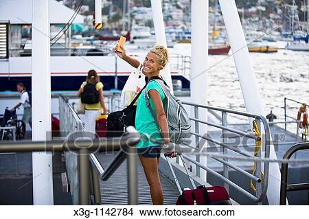 Picture - Girls bid bon voyage as they leave the enchanted isle of Santa Catalina, California, USA. Fotosearch
