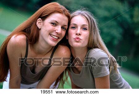 Girls blowing kiss View Large Photo Image Stock Image - Girls blowing kiss. Fotosearch