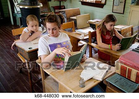 Stock Image - girls in old schoolhouse. Fotosearch