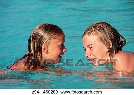 Girls in swimming pool View Large Photo Image Stock Image - Girls in swimming pool. Fotosearch