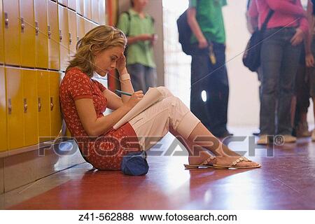 Girls is making homework in the hallway. View Large Photo Image Stock Photo - Girls is making homework in the hallway.. Fotosearch