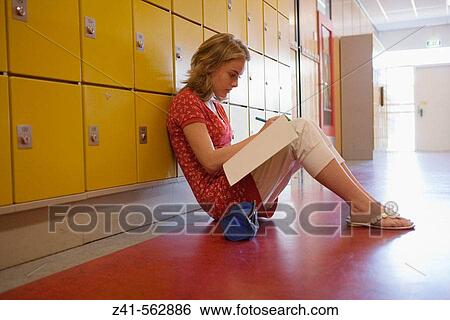 Girls is making homework in the hallway. View Large Photo Image Stock Photograph - Girls is making homework in the hallway.. Fotosearch