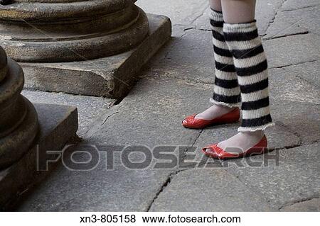 Girl's legs with red shoes View Large Photo Image Stock Photo - Girl's legs with red shoes. Fotosearch