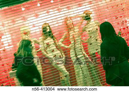 Girls looking at shop window View Large Photo Image Picture - Girls looking at shop window. Fotosearch