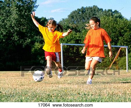 Picture - Girls playing soccer. Fotosearch