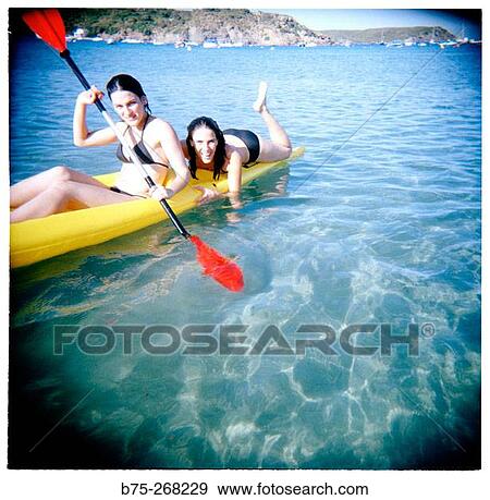 Girls rowing at the beach View Large Photo Image Stock Photo - Girls rowing at the beach. Fotosearch