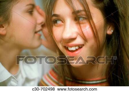 Girls whisper secret View Large Photo Image Stock Photo - Girls whisper secret. Fotosearch