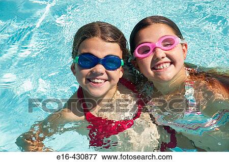 Girls with goggles in pool View Large Photo Image Stock Photo - Girls with goggles in pool. Fotosearch
