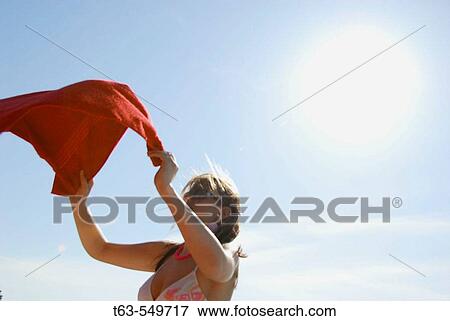 girl/woman 20 yrs old on beach with red towel View Large Photo Image Stock Photo - girl/woman 20 yrs old on beach with red towel. Fotosearch