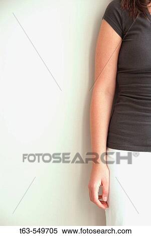 girl/woman 20 yrs old standing against a wall View Large Photo Image Stock Photography - girl/woman 20 yrs old standing against a wall. Fotosearch