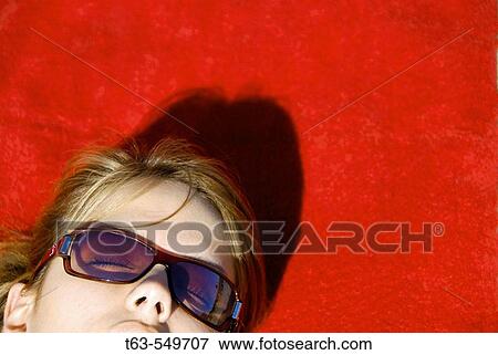 girl/woman 20 yrs old suntan on red towel on beach View Large Photo Image Stock Photo - girl/woman 20 yrs old suntan on red towel on beach. Fotosearch