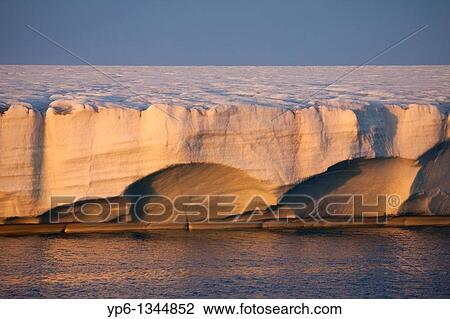 Stock Image - glacier Brasvellbreen in sunset light, Nordaustlandet, Svalbard. Fotosearch