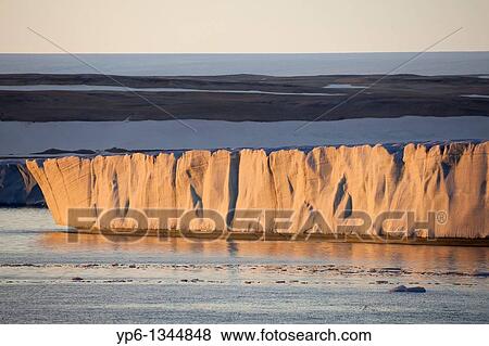Stock Photo - glacier Brasvellbreen in sunset light, Nordaustlandet, Svalbard. Fotosearch