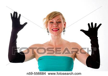 Glamorously dressed young woman exressing her excitement. View Large Photo Image Picture - Glamorously dressed young woman exressing her excitement.. Fotosearch