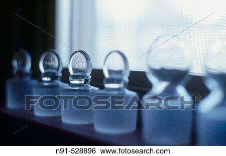 Glass bottle stoppers or plugs on window sill View Large Photo Image Stock Photograph - Glass bottle stoppers or plugs on window sill. Fotosearch