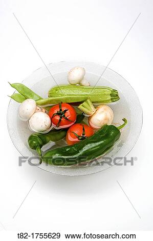 glass container with fresh vegetables and water on white background View Large Photo Image Stock Photo - glass container with fresh vegetables and water on white background. Fotosearch