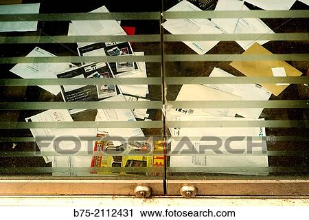 Glass door of a closed business with plenty of envelopes and papers on the floor. London, England, UK, Europe. View Large Photo Image Stock Image - Glass door of a closed business with plenty of envelopes and papers on the floor. London, England, UK, Europe.. Fotosearch