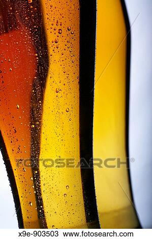 Glass of beer with condensed water pearls View Large Photo Image Stock Image - Glass of beer with condensed water pearls. Fotosearch