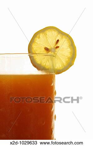Glass of fresh fruit juice blend with a slice of lemon Isolated Copy space View Large Photo Image Stock Image - Glass of fresh fruit juice blend with a slice of lemon Isolated Copy space. Fotosearch