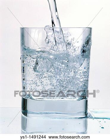Glass of Sparkling Water against White Background View Large Photo Image Picture - Glass of Sparkling Water against White Background. Fotosearch