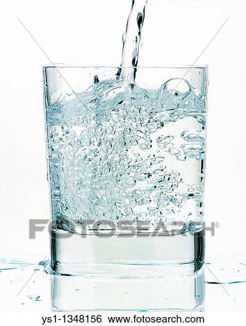 Stock Photograph - GLASS OF WATER AGAINST WHITE BACKGROUND. Fotosearch