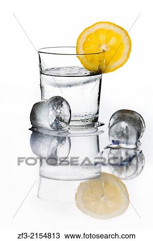 Glass of water with a lemon slice an ice cubes. View Large Photo Image Stock Image - Glass of water with a lemon slice an ice cubes.. Fotosearch