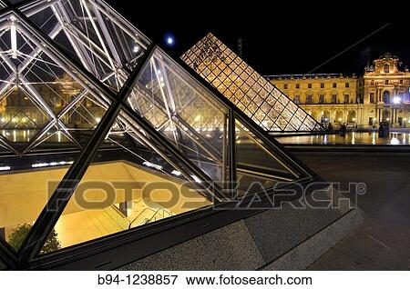 Stock Photo - Glass pyramide, by Ieo Ming Pei, at Napol? on court. Palais du Louvre. Mus? e du Louvre. Paris, France.. Fotosearch