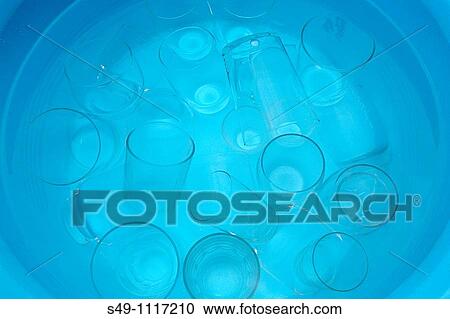 Stock Image - glasses in a water bucket. Fotosearch