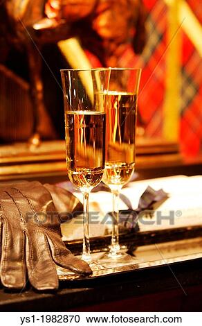 Glasses of Champagne with Leather Glove. View Large Photo Image Stock Image - Glasses of Champagne with Leather Glove.. Fotosearch