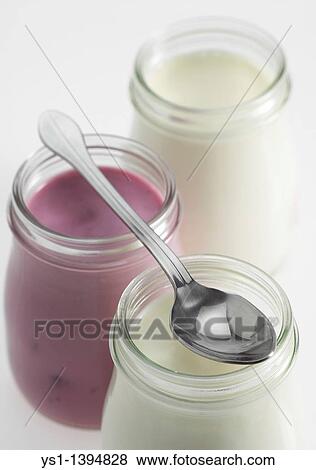 Glasses of Natural and Raspberry Yoghurt against White Background View Large Photo Image Stock Photo - Glasses of Natural and Raspberry Yoghurt against White Background. Fotosearch