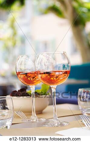 Stock Image - Glasses of ros? (Bandol AOC) on the table of a restaurant, La Cadi? re-d? Azur, Var, Provence-Alpes-C? te d? Azur, France. Fotosearch