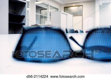 glasses on a table. View Large Photo Image Picture - glasses on a table.. Fotosearch
