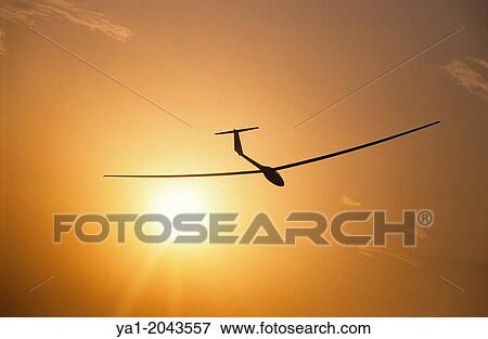 Glider plane ASH-25 flying on sunset near Santa Cilia de Jaca, Aragon, Spain. View Large Photo Image Stock Photo - Glider plane ASH-25 flying on sunset near Santa Cilia de Jaca, Aragon, Spain.. Fotosearch