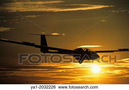 Glider plane ASH-25 landing on sunset at Santa Cilia de Jaca aerodrome, Aragon, Spain. View Large Photo Image Stock Photograph - Glider plane ASH-25 landing on sunset at Santa Cilia de Jaca aerodrome, Aragon, Spain.. Fotosearch