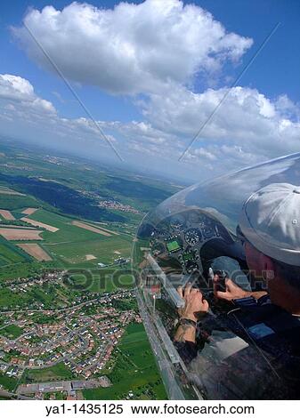 Glider plane cockpit view over Sarreguemines town and airfield, Lorraine, France. Glider model's Duo-Discus. View Large Photo Image Stock Photography - Glider plane cockpit view over Sarreguemines town and airfield, Lorraine, France. Glider model's Duo-Discus.. Fotosearch