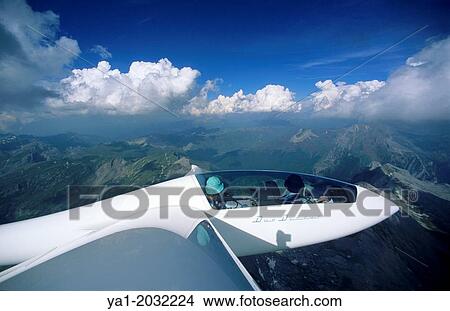Picture - Glider plane Duo Discus flying over Bisaurin mountains, Aragon, Spain.. Fotosearch