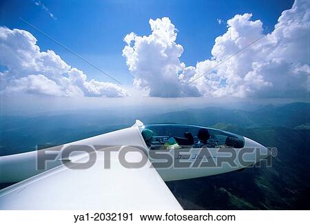Glider plane Duo Discus flying over Pyrenees mountains, north of Jaca, Aragon, Spain. View Large Photo Image Stock Image - Glider plane Duo Discus flying over Pyrenees mountains, north of Jaca, Aragon, Spain.. Fotosearch