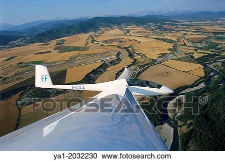 Glider plane Duo Discus flying over aerodrome of Santa Cilia de Jaca, Aragon, Spain. View Large Photo Image Stock Image - Glider plane Duo Discus flying over aerodrome of Santa Cilia de Jaca, Aragon, Spain.. Fotosearch