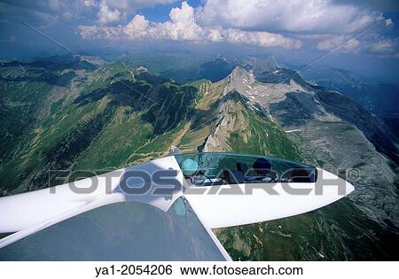 Glider plane Duo Discus flying over Bisaurin mountains, Aragon, Spain. View Large Photo Image Stock Photograph - Glider plane Duo Discus flying over Bisaurin mountains, Aragon, Spain.. Fotosearch
