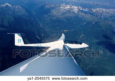 Glider plane Duo Discus flying over Somport pass, Aragon, Spain. View Large Photo Image Stock Photography - Glider plane Duo Discus flying over Somport pass, Aragon, Spain.. Fotosearch