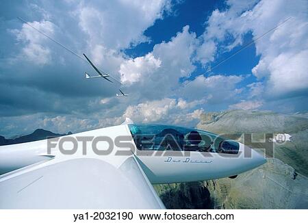 Glider plane Duo Discus flying with two others over Pyrenees mountains, north of Jaca, Aragon, Spain. View Large Photo Image Stock Image - Glider plane Duo Discus flying with two others over Pyrenees mountains, north of Jaca, Aragon, Spain.. Fotosearch
