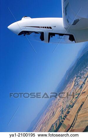 Glider plane Twin Astir in aerobatic flight near Santa Cilia de Jaca, Aragon, Spain. View Large Photo Image Stock Photography - Glider plane Twin Astir in aerobatic flight near Santa Cilia de Jaca, Aragon, Spain.. Fotosearch