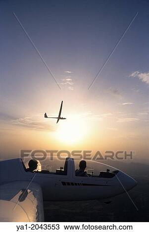 Glider planes Twin Astir and ASH-25 flying on sunset near Santa Cilia de Jaca, Aragon, Spain. View Large Photo Image Stock Image - Glider planes Twin Astir and ASH-25 flying on sunset near Santa Cilia de Jaca, Aragon, Spain.. Fotosearch